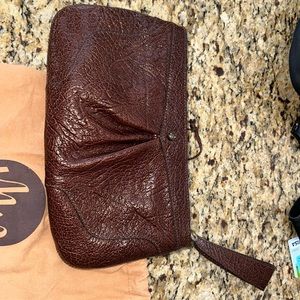 Never used!  Beautiful brown leather Monsac clutch